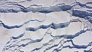 Aerial view of natural dried up white baths. Travertines of Pamukkale in Turkey