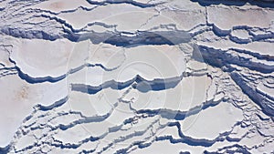 Aerial view of natural dried up white baths. Travertines of Pamukkale in Turkey