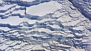 Aerial view of natural dried up white baths. Travertines of Pamukkale in Turkey