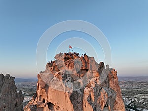 Aerial view of natural rock formations in the sunset, valley with cave houses in Cappadocia, Turkey. Natural landscape
