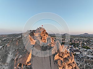 Aerial view of natural rock formations in the sunset, valley with cave houses in Cappadocia, Turkey. Natural landscape