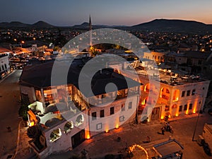 Aerial view of natural rock formations in the sunset, valley with cave houses in Cappadocia, Turkey. Natural landscape