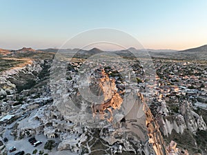 Aerial view of natural rock formations in the sunset, valley with cave houses in Cappadocia, Turkey. Natural landscape