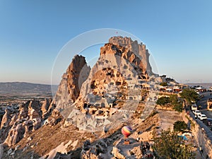 Aerial view of natural rock formations in the sunset, valley with cave houses in Cappadocia, Turkey. Natural landscape