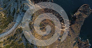 Aerial view of natural and wild coast in Sicily in summer. Drone point of view of beautiful white bay in Salina, rocks