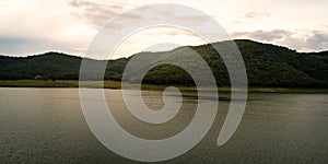 aerial view of nature background with green mountain and lake