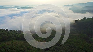 Aerial View of nature fog mist over mountain during sunrise