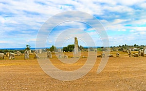 Aerial view of the Neolithic Xerez Stone Circle in the countryside against a blue sky