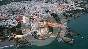 Aerial view of Nerja city with coastline in province of Malaga at night, Andalusia, southern Spain