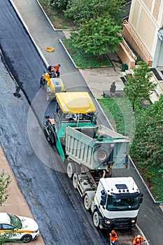 Aerial view new asphalt road paving set under construction