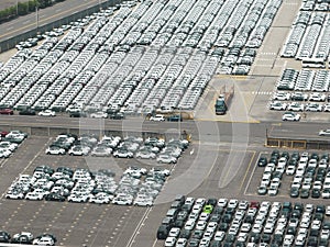 Aerial view of New car lined up in the port for import export around the world