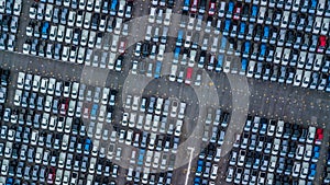 Aerial view new cars lined up in the port for import and export, Top view of new cars lined up outside an automobile factory for