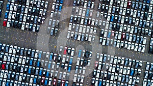 Aerial view new cars parking for sale stock lot row, New cars dealer inventory import export business commercial global, photo