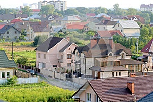 Aerial view of new modern residential houses. Comfortable buildings in countryside.