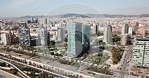 Aerial view of new residential complex of Diagonal Mar i el Front Maritim del Poblenou in sunny day, Barcelona, Spain