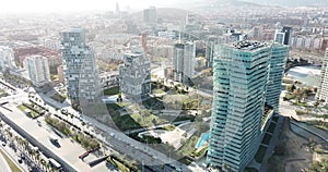 Aerial view of new residential complex of Diagonal Mar i el Front Maritim del Poblenou in sunny day, Barcelona, Spain