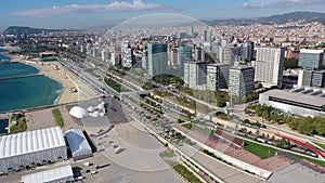 Aerial view of new residential complex of Diagonal Mar i el Front Maritim del Poblenou on sunny fall day, Barcelona