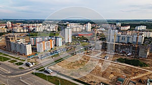 Aerial view of the new urban development. New houses are being built. The cranes are visible