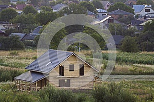 Aerial view of new wooden ecological traditional house cottage of natural lumber materials with attic floor, porch, balcony and