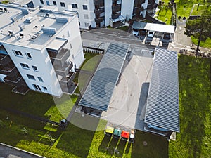 Aerial view of newly build residential buildings with covered parking spaces in front