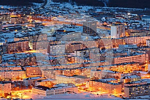 Aerial view of the night city. Cityscape with many buildings.