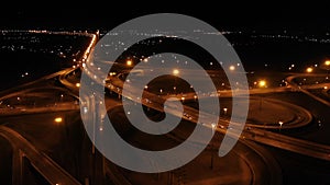 Aerial view of night highway. Junction on the highway in the dark