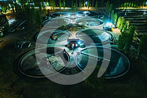 Aerial view at night wastewater treatment plant, filtration of dirty or sewage water