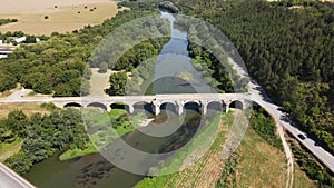 Aerial view of Nineteenth-century bridge over the Yantra River, known as the Kolyu Ficheto Bridge in Byala, Bulgaria