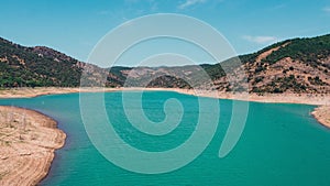 Aerial view of the Noguera Ribagorzana river with a cloudy blue sky in the background, Spain photo