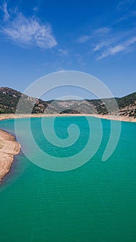 Aerial view of the Noguera Ribagorzana river with a cloudy blue sky in the background, Spain photo