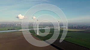 Aerial view of non-running wind turbines in a Dutch landscape.