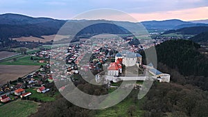 Aerial view of northeastern side of castle Slovenska Lupca and town of the same name under castle hill.