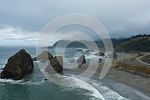 Aerial view of a northwest Pacific shoreline on a rainy, cloudy day in Oregon, United Sates