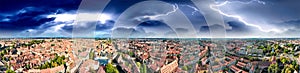 Aerial view of Nuremberg cityscape with river and medieval buildings with storm coming on background, Germany