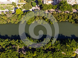 Aerial view o Marapendi canal in Barra da tijuca on a summer day. Green vegetation can be seen on both sides, as well as