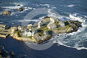 Aerial view of ocean-front homes on Perkins Cove, on coast of Maine south of Portland
