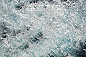 Aerial view ocean surface with waves. Blue water background