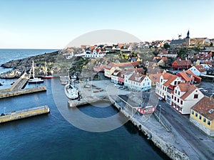 an aerial view of the ocean and town in a small region