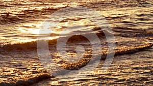 Aerial view ocean waves crashing on beach