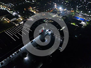 aerial view of office building and warehouse distribution center of retail based company at night