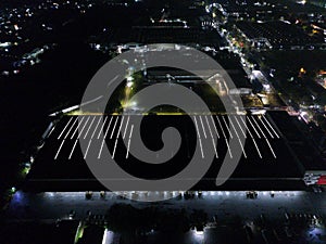 aerial view of office building and warehouse distribution center of retail based company at night