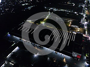 aerial view of office building and warehouse distribution center of retail based company at night