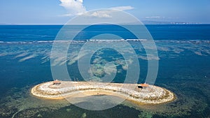 Aerial view of an offshore gazebo protected by a huge, fringing tropical coral reef