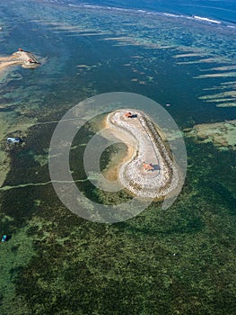 Aerial view of an offshore gazebo protected by a huge, fringing tropical coral reef