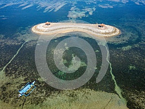 Aerial view of an offshore gazebo protected by a huge, fringing tropical coral reef