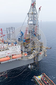 Aerial View of Offshore Jack Up Drilling Rig and Supply Vessel