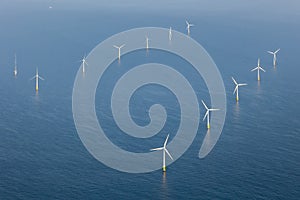 Aerial view of offshore wind farm with wind turbines on the North Sea