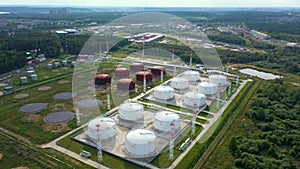 Aerial view. Oil and fuel tank farm. Fuel storage station. Industrial facility. Drone moves by circle, camera moves down