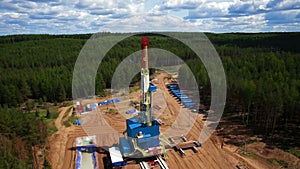 Aerial view oil gas drilling tower in forest
