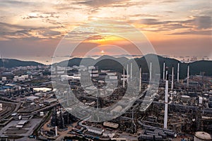 Aerial view of Oil and gas industry - refinery, and Petrochemical plant on island at evening sunset background